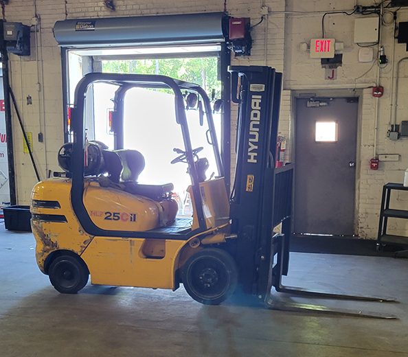 forklift parked in warehouse bay